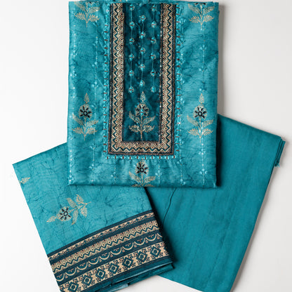 Chanderi silk dress material with print design, embroidery work, thread work and sequins work. It has zari and mirror work in neck area also. Silk dupatta with beautiful digital prints matching the top color. Cotton silk bottom same teal blue color as the top and dupatta. 