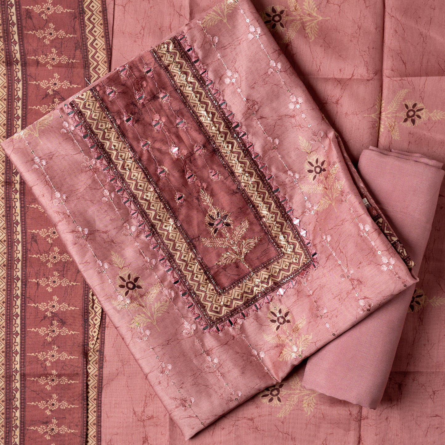 Chanderi silk dress material with print design, embroidery work, thread work and sequins work. It has zari and mirror work in neck area also. Silk dupatta with beautiful digital prints matching the top color. Cotton silk bottom same Light Wine color as the top and dupatta. 