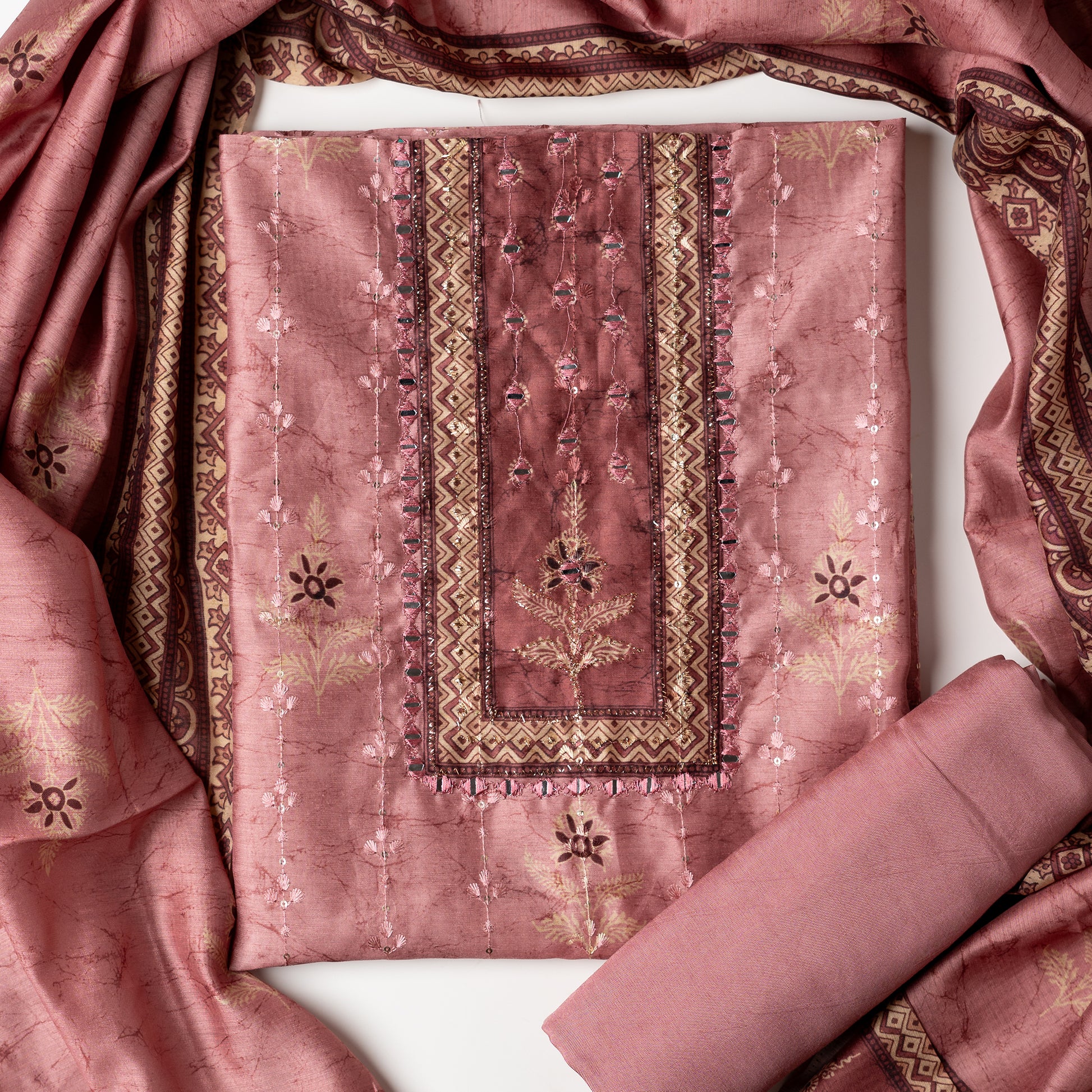 Chanderi silk dress material with print design, embroidery work, thread work and sequins work. It has zari and mirror work in neck area also. Silk dupatta with beautiful digital prints matching the top color. Cotton silk bottom same Light Wine color as the top and dupatta.