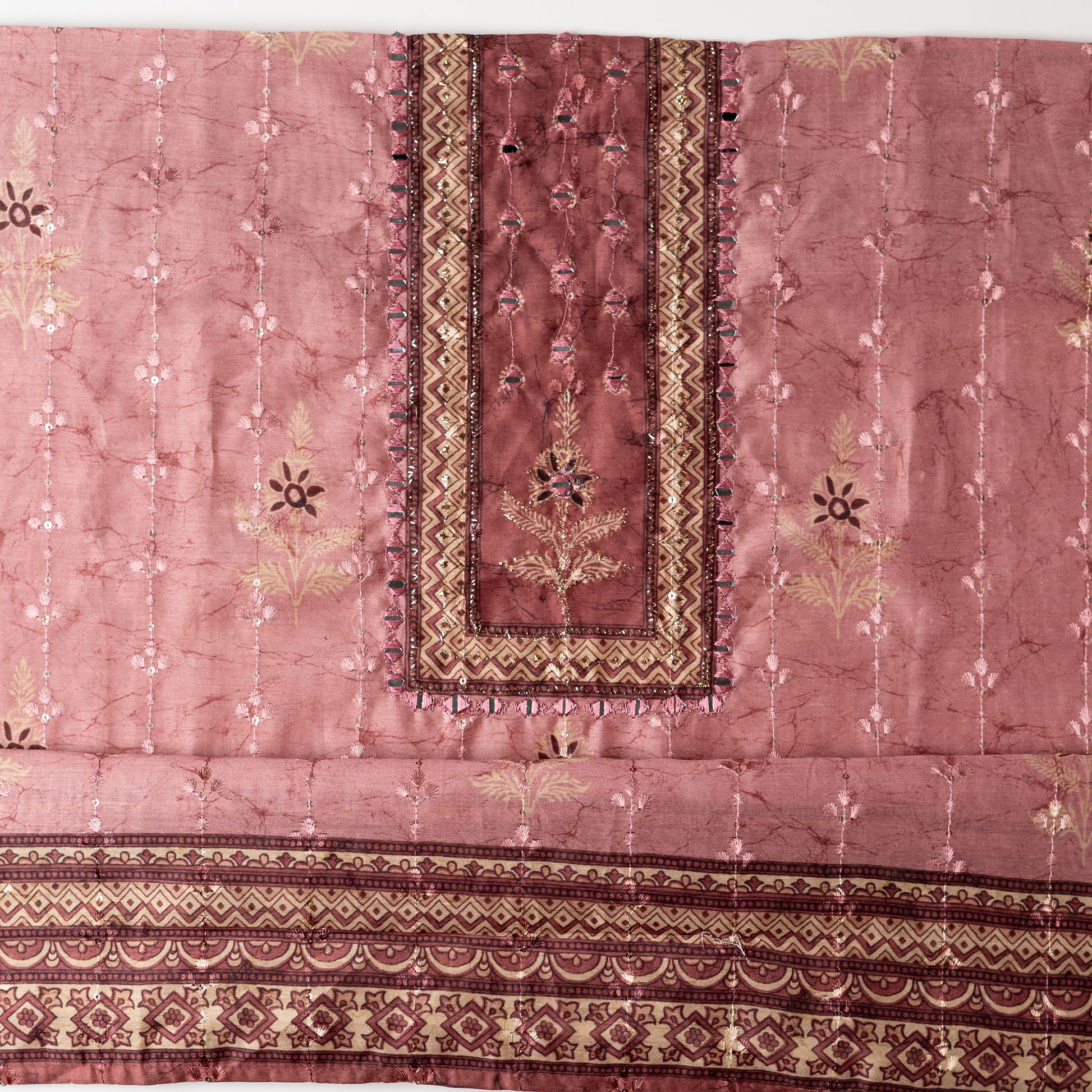 Chanderi silk dress material with print design, embroidery work, thread work and sequins work. It has zari and mirror work in neck area also.