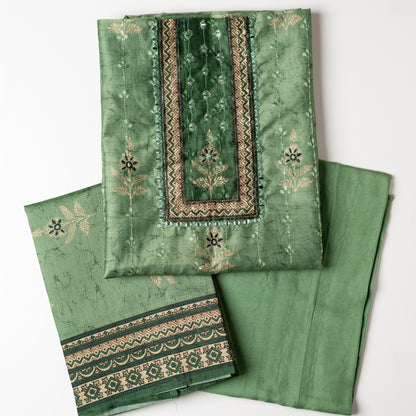 Chanderi silk dress material with print design, embroidery work, thread work and sequins work. It has zari and mirror work in neck area also. Silk dupatta with beautiful digital prints matching the top color. Cotton silk bottom same green color as the top and dupatta. 