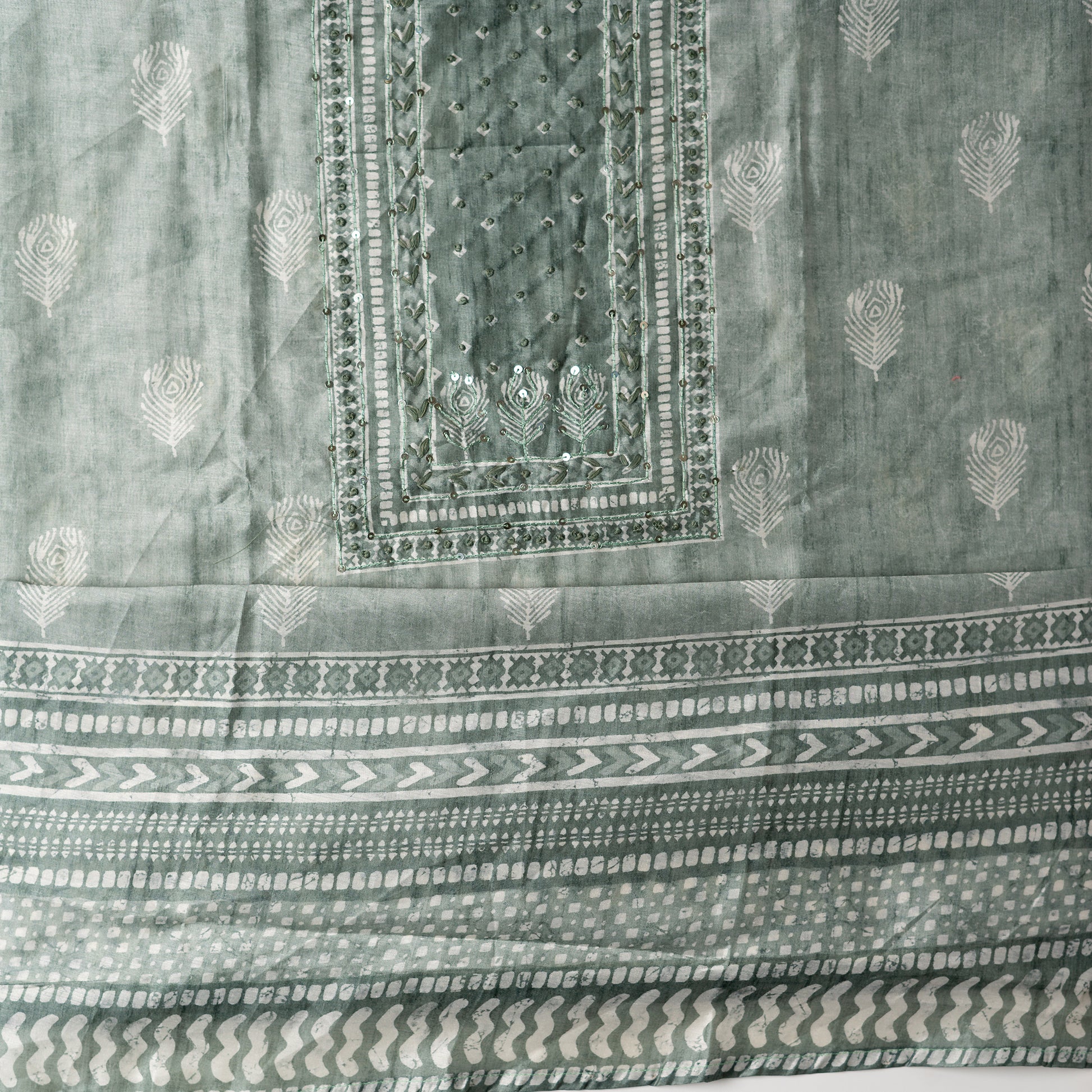 Chanderi silk dress material with thread work and and sequins work, the thread work is done with the same color thread of the top.