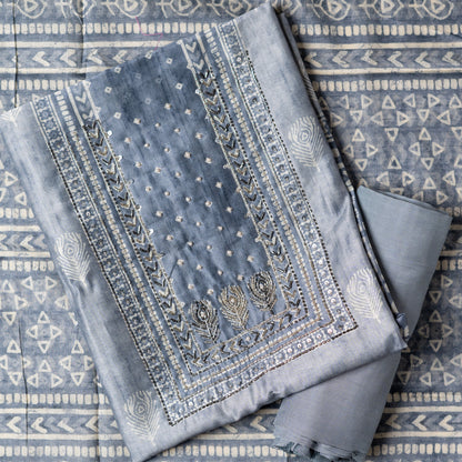 Chanderi silk dress material with thread work, bead work and and sequins work. The neck area is filled with beautiful bead and sequins works. Digital printed silk dupatta  with same color combination as top. Light grey color cotton silk bottom, matching the top and dupatta color.