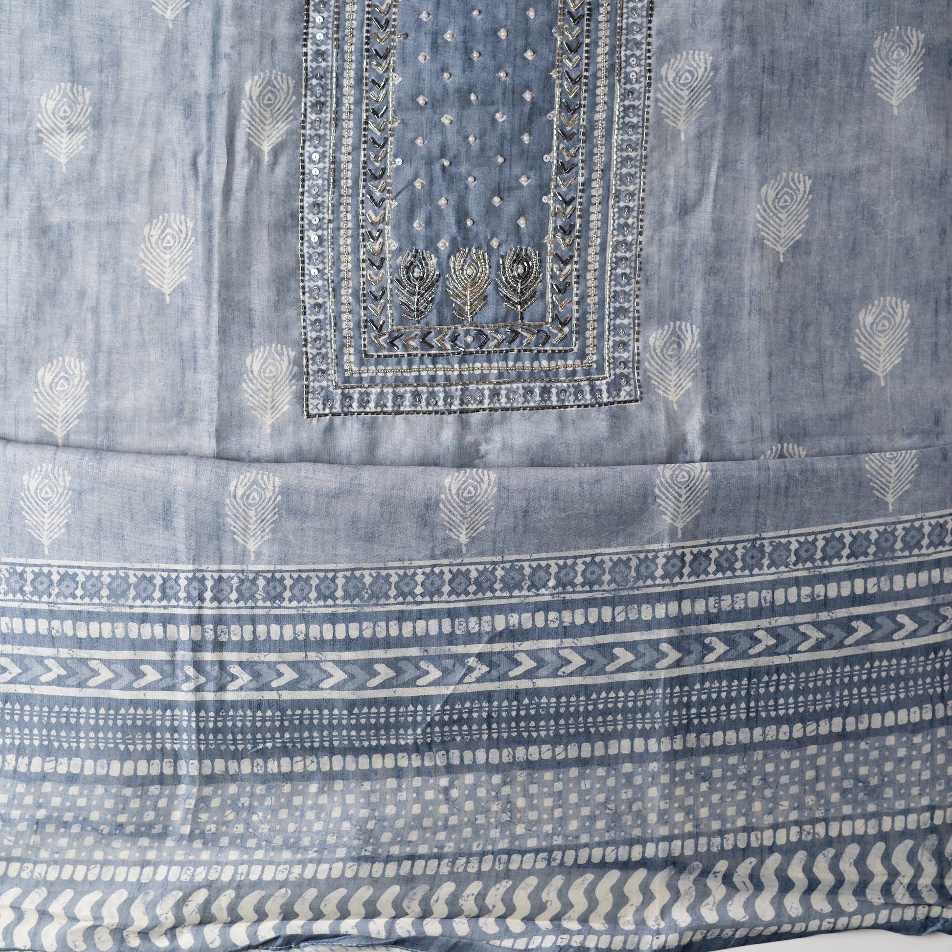 Chanderi silk dress material with thread work and and sequins work, the thread work is done with the same color thread of the top. light grey color