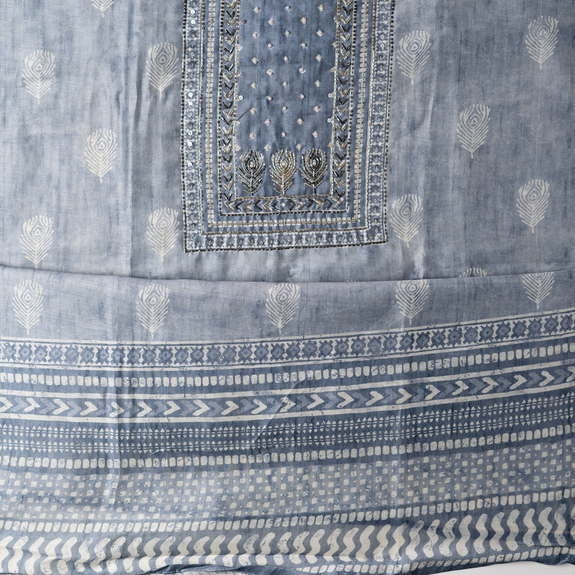 Chanderi silk dress material with thread work and and sequins work, the thread work is done with the same color thread of the top. light grey color