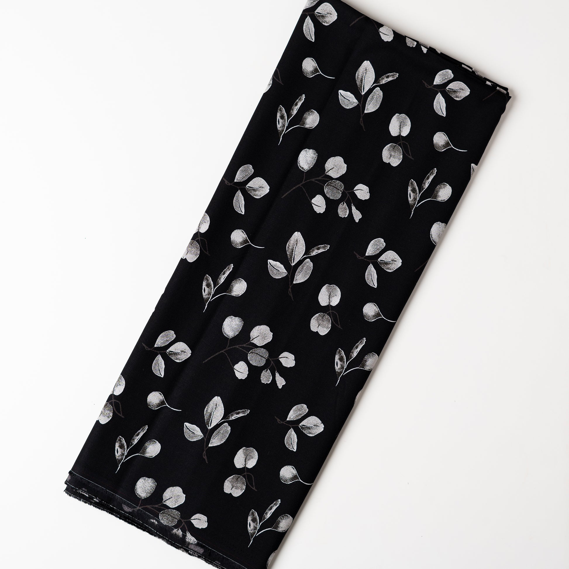 Rayon black color fabric with grey and white color mix prints, suitable for kurti/kurta, tops, or gowns. 