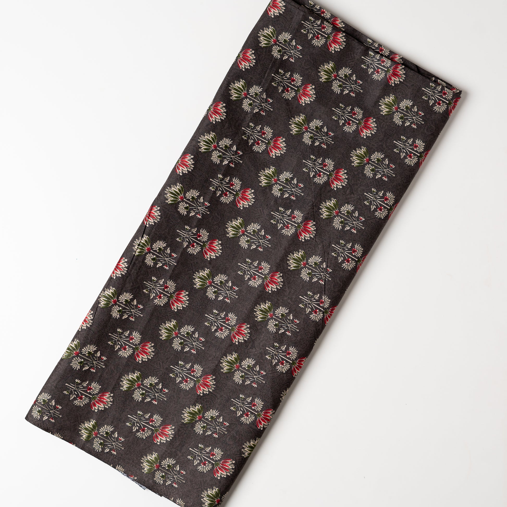 dark brown color printed fabric with maroon, green and cream color beautiful prints