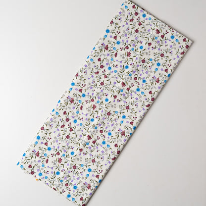 White color fabric with multi color small elegant print design