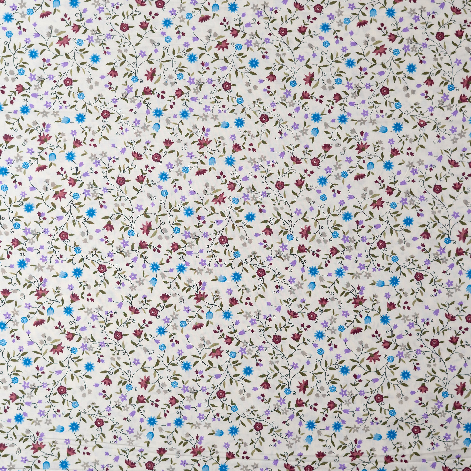 White color fabric with multi color small elegant print design