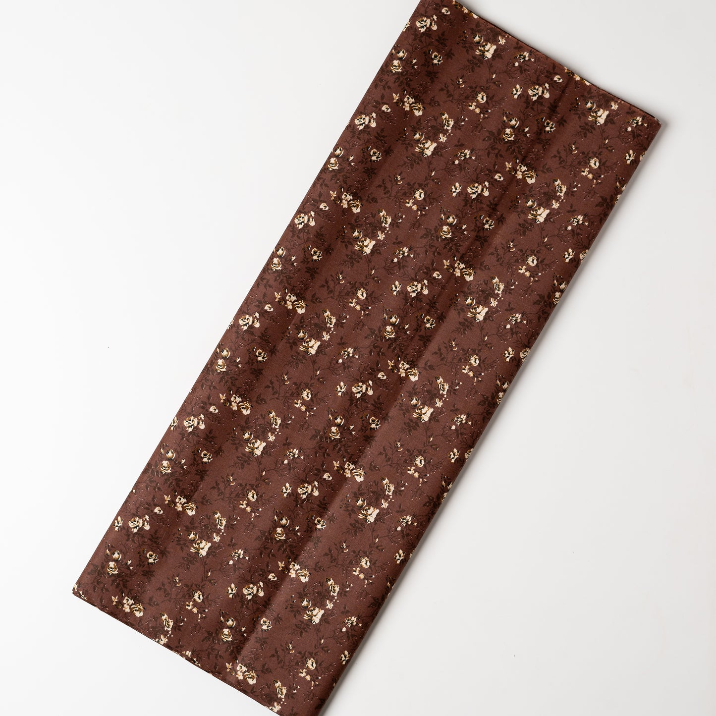 Brown color cotton printed running fabrics with cream color floral prints