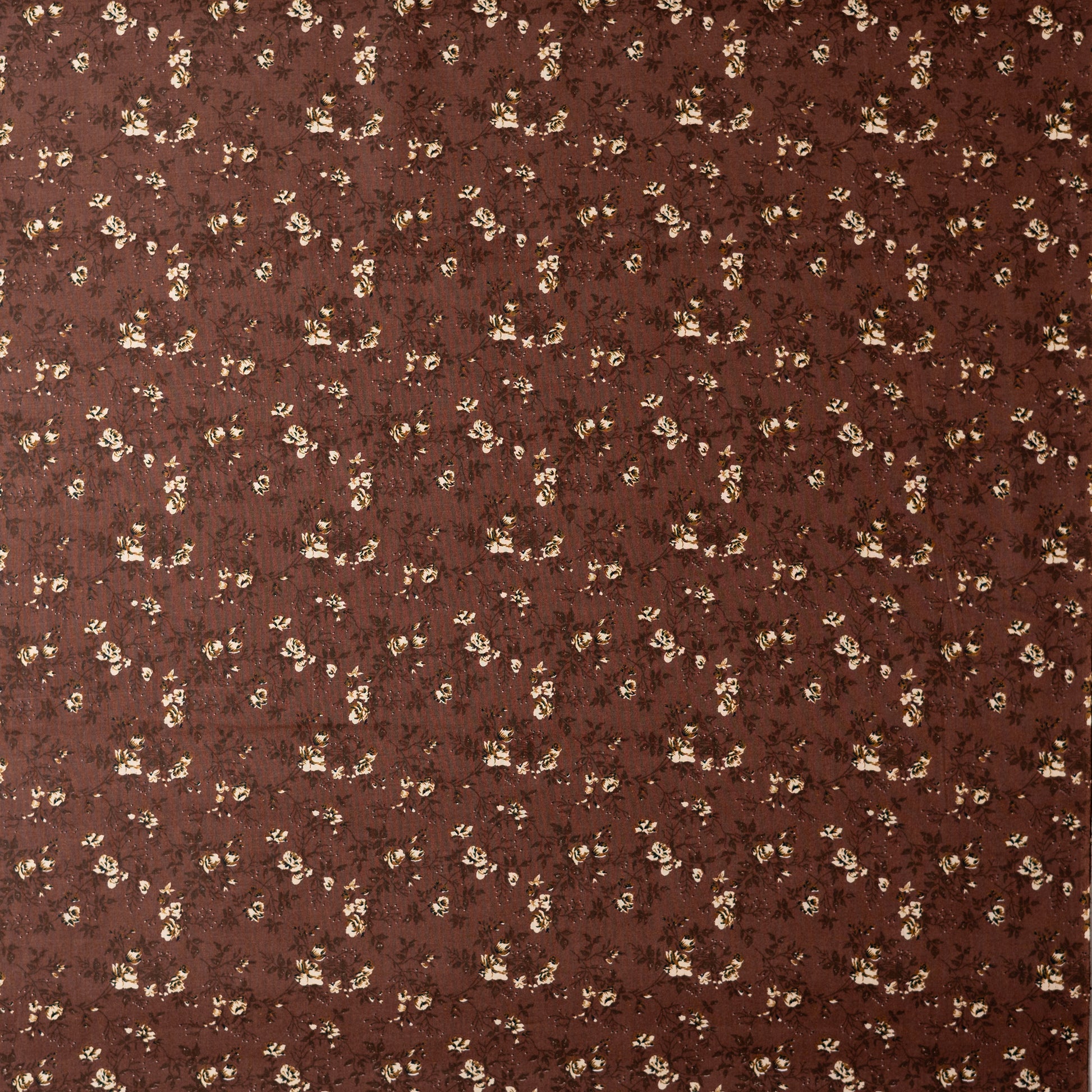 Brown color cotton printed running fabrics with cream color floral prints