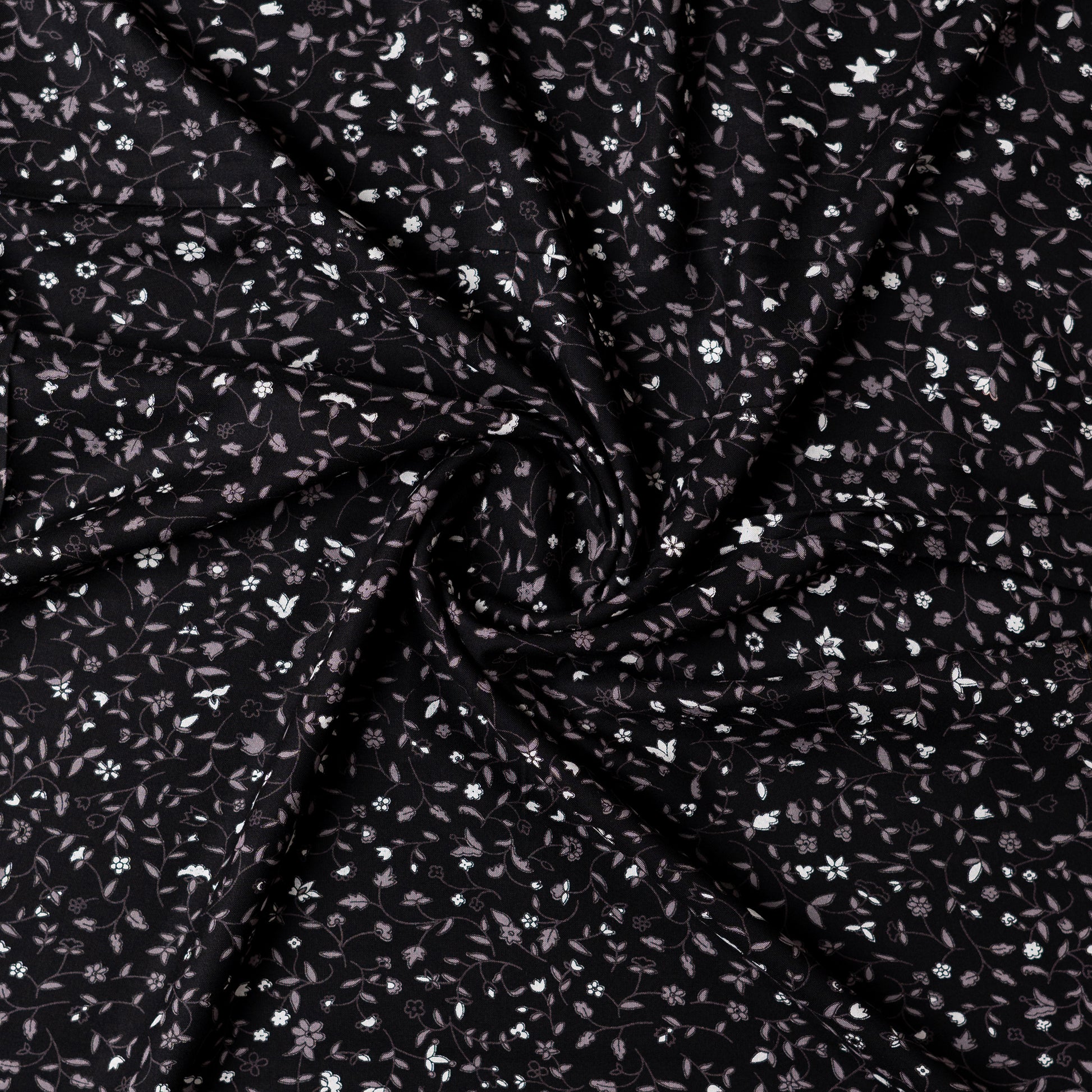 Black color rayon fabric with white and grey color floral prints, this is a small print elegant design.