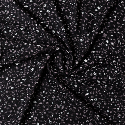Black color rayon fabric with white and grey color floral prints, this is a small print elegant design.