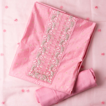 This is one of the best gift for your mom, a beautiful light pink color chanderi silk top with nicely crafted embroidery work in neck line, golden color jacquard weaving all over the body, embroidery work on the border of the dress matching the neck line, it has also golden color sequins work in the border. Beautiful silk dupatta with floral embroidery and the borders are perfectly in sync with the top border, embroidery work and sequins. Plain light pink color soft cotton silk bottom.