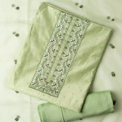 This is one of the best gift for your mom, a beautiful light green color chanderi silk top with nicely crafted embroidery work in neck line, golden color jacquard weaving all over the body, embroidery work on the border of the dress matching the neck line, it has also golden color sequins work in the border. Beautiful silk dupatta with floral embroidery and the borders are perfectly in sync with the top border, embroidery work and sequins. Plain light green color soft cotton silk bottom.