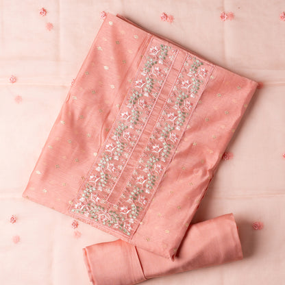 This is one of the best gift for your mom, a beautiful light peach color chanderi silk top with nicely crafted embroidery work in neck line, golden color jacquard weaving all over the body, embroidery work on the border of the dress matching the neck line, it has also golden color sequins work in the border. Beautiful silk dupatta with floral embroidery and the borders are perfectly in sync with the top border, embroidery work and sequins. Plain light peach color soft cotton silk bottom