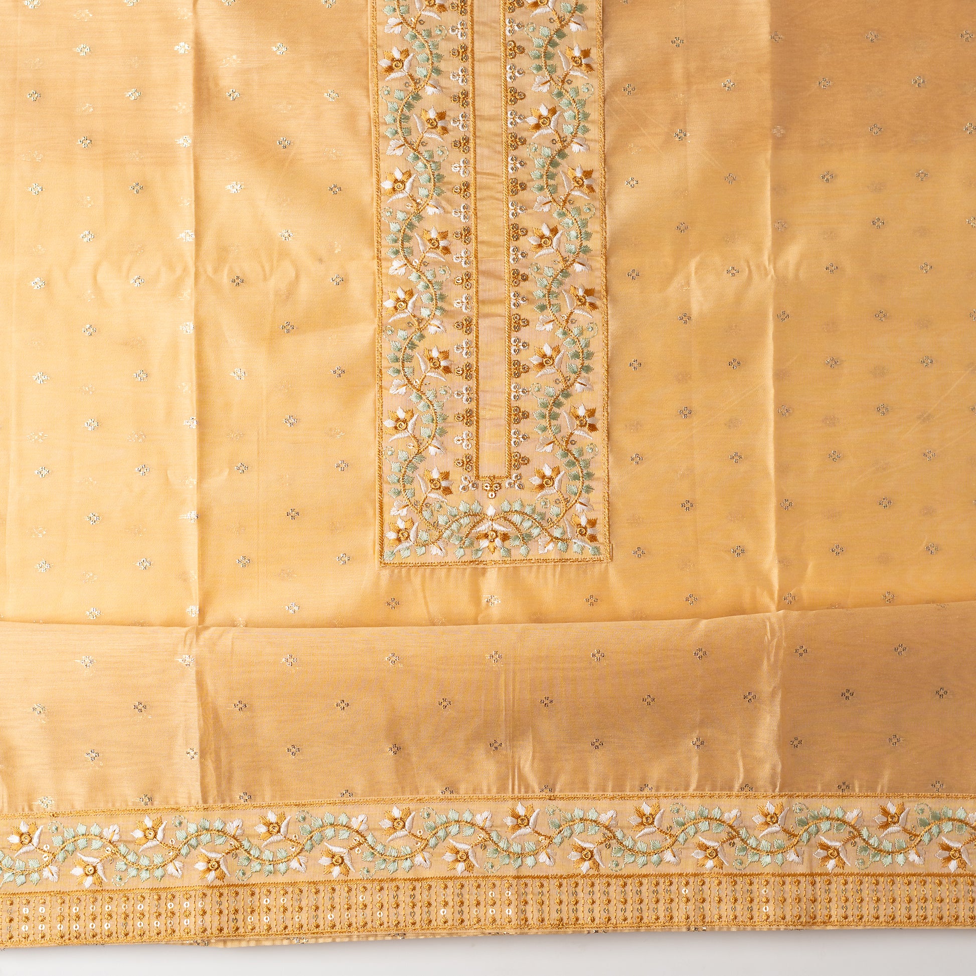 chanderi silk top with nicely crafted embroidery work in neck line, golden color jacquard weaving all over the body, embroidery work on the border of the dress matching the neck line, it has also golden color sequins work in the border