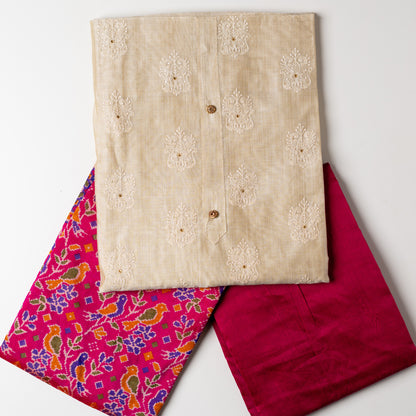 Chanderi silk dress material with embroidery and sequins work, the embroidery work is done with the same color thread of the top which gives a very elegant look. The top has show buttons and golden color piping in the border colorful digital printed silk dupatta , magenta color cotton silk bottom