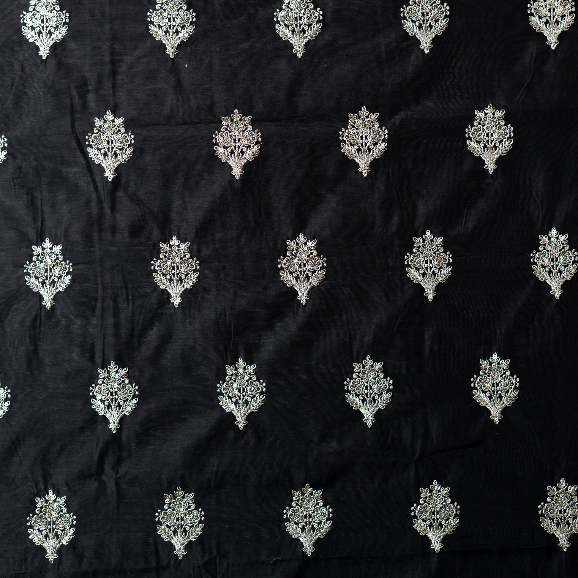 chanderi silk unstitched dress material in black color with silver color embroidery work all over the body 