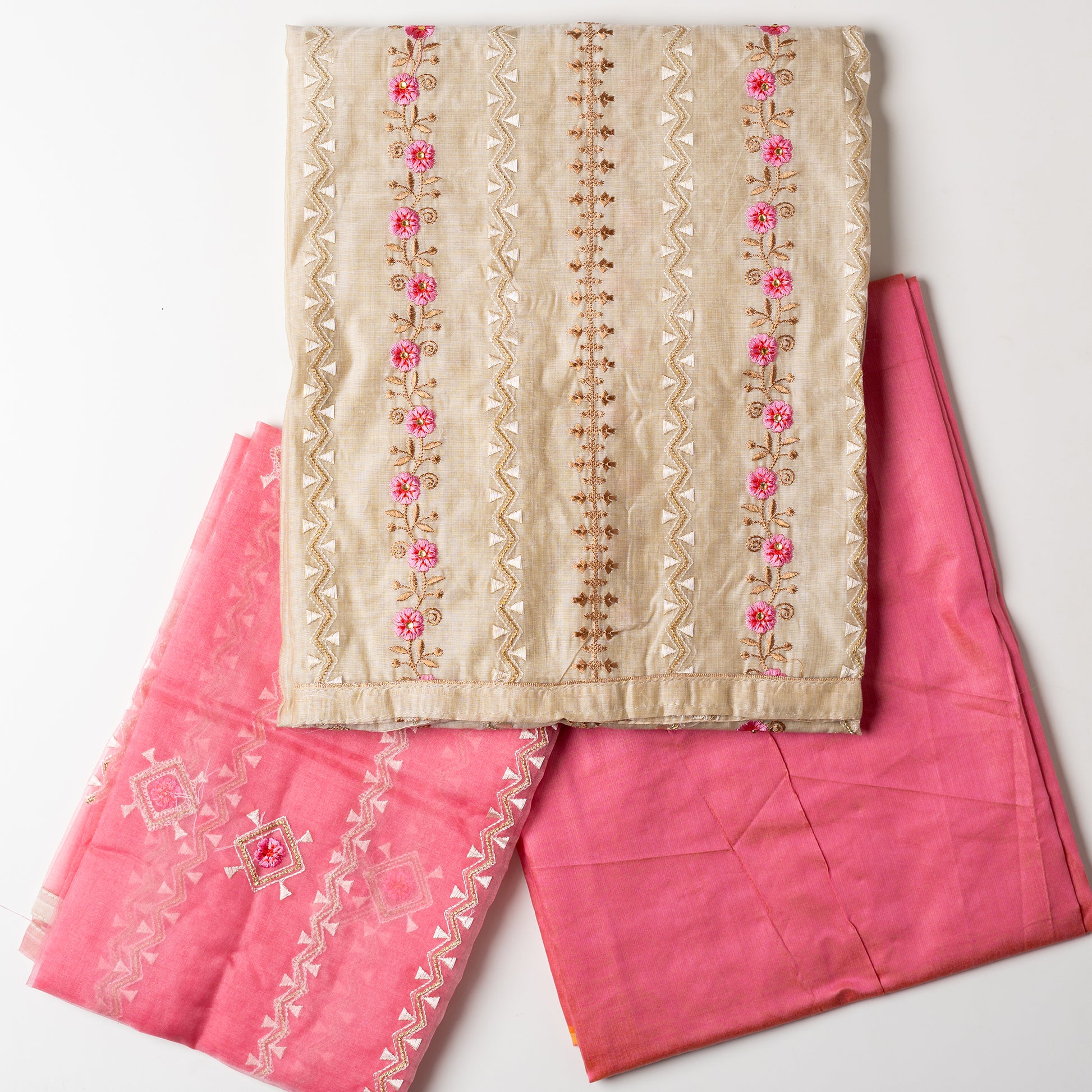 Unstitched Chanderi silk dress material with pink color embroidery work and zari thread work in between the embroidery. Cotton silk pink color bottom, Silk dupatta with embroidery work and zari thread work matching the top design