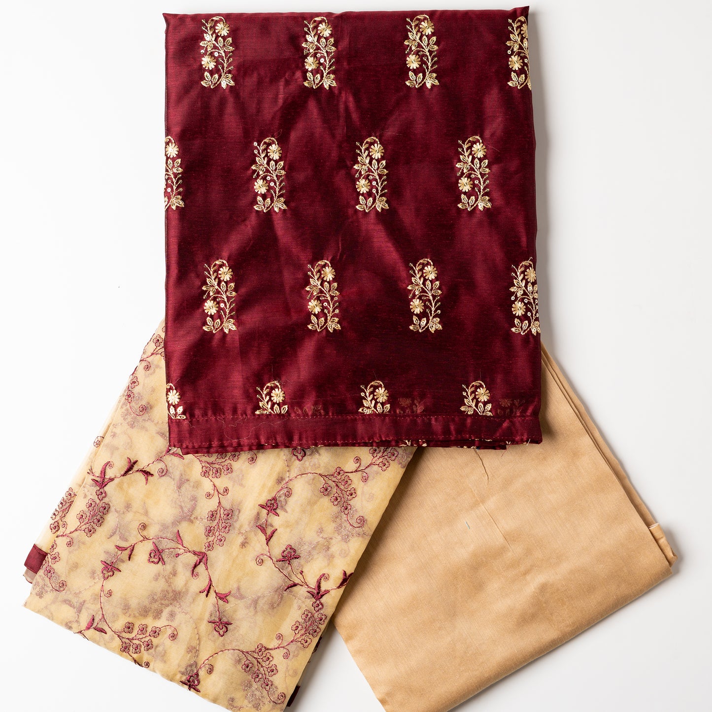 This beautiful chanderi silk dress material set will suit you for any of your functions, be it evening party, bridal wear, birthday party or anniversary gift. Maroon color top with elegent embroidery and sequins work. Cream color silk dupatta with matching maroon color embroidery work is giving the set a perfect party wear look. Cotton silk cream color border.