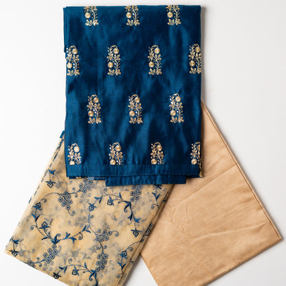 This beautiful chanderi silk dress material set will suit you for any of your functions, be it evening party, bridal wear, birthday party or anniversary gift. Blue color top with elegant embroidery and sequins work. Cream color silk dupatta with matching blue color embroidery work is giving the set a perfect party wear look. Cotton silk cream color border.