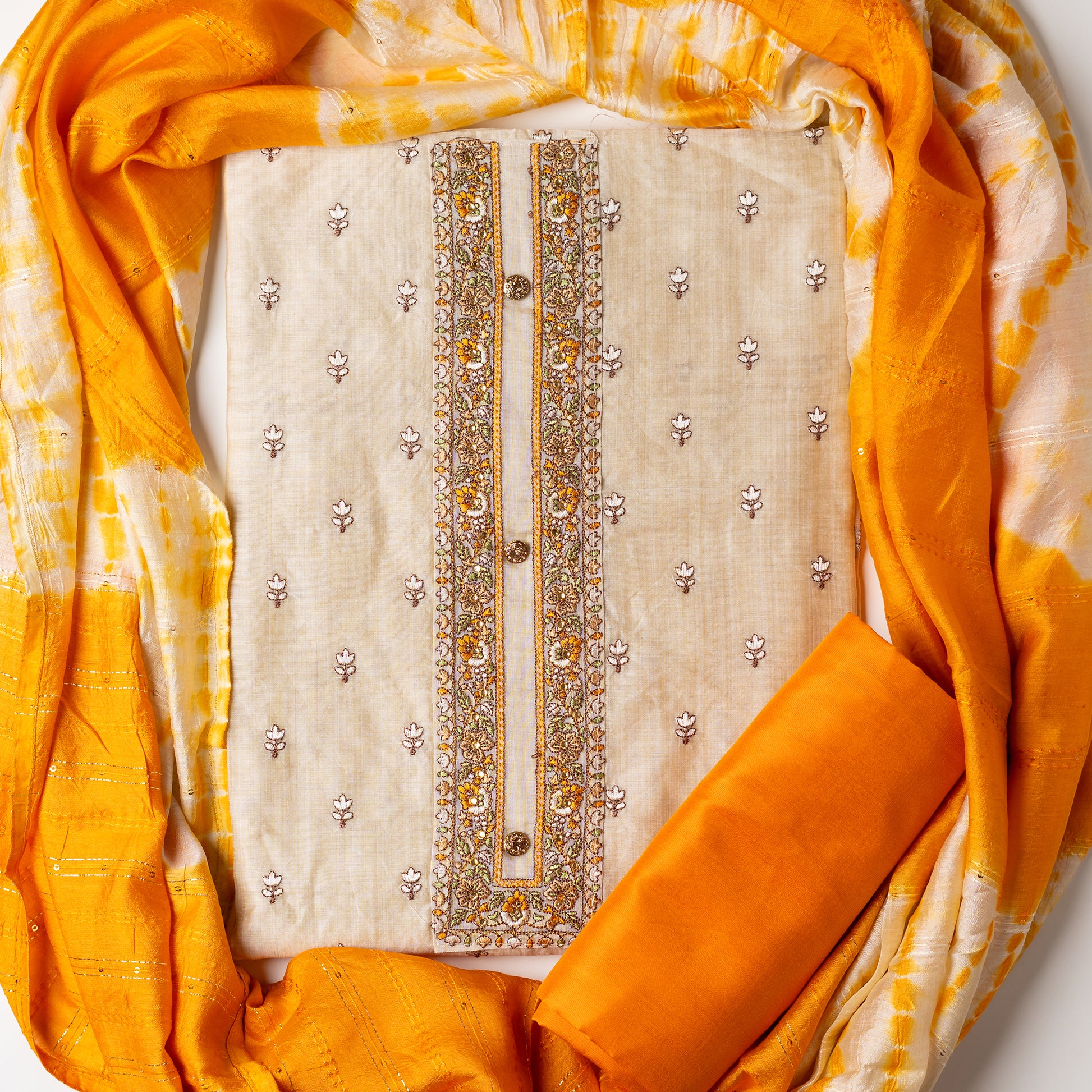 Chanderi Silk Dress material set, Ivory color Chanderi Silk top with floral embroidery all over the body in the front and elegant embroidery work in neck line with show buttons. cotton mustard color plain bottom. Mustard and cream color silk dupatta with sequins and thread work