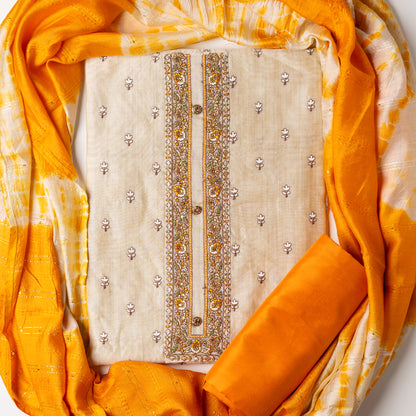 Chanderi Silk Dress material set, Ivory color Chanderi Silk top with floral embroidery all over the body in the front and elegant embroidery work in neck line with show buttons. cotton mustard color plain bottom. Mustard and cream color silk dupatta with sequins and thread work 