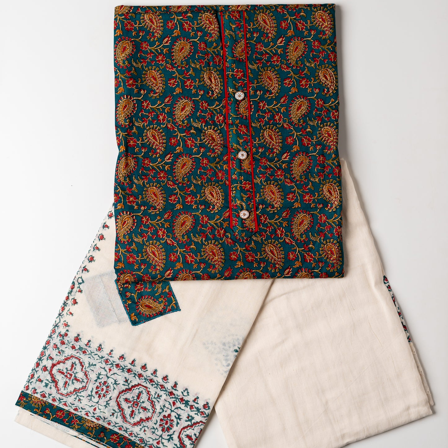 cotton dress material for women, Cotton top with multi color print design, buttons and contrast color piping in yoke, cream color cotton bottom with hakoba design at the edges and print. Cotton dupatta with matching color prints and cut works