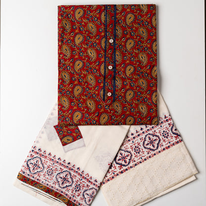 Churidar set, Cotton top with maroon color base and multi color print design, buttons and contrast color piping in yoke, cream color cotton bottom with hakoba design at the edges and print. Cotton dupatta with matching color prints and cut work