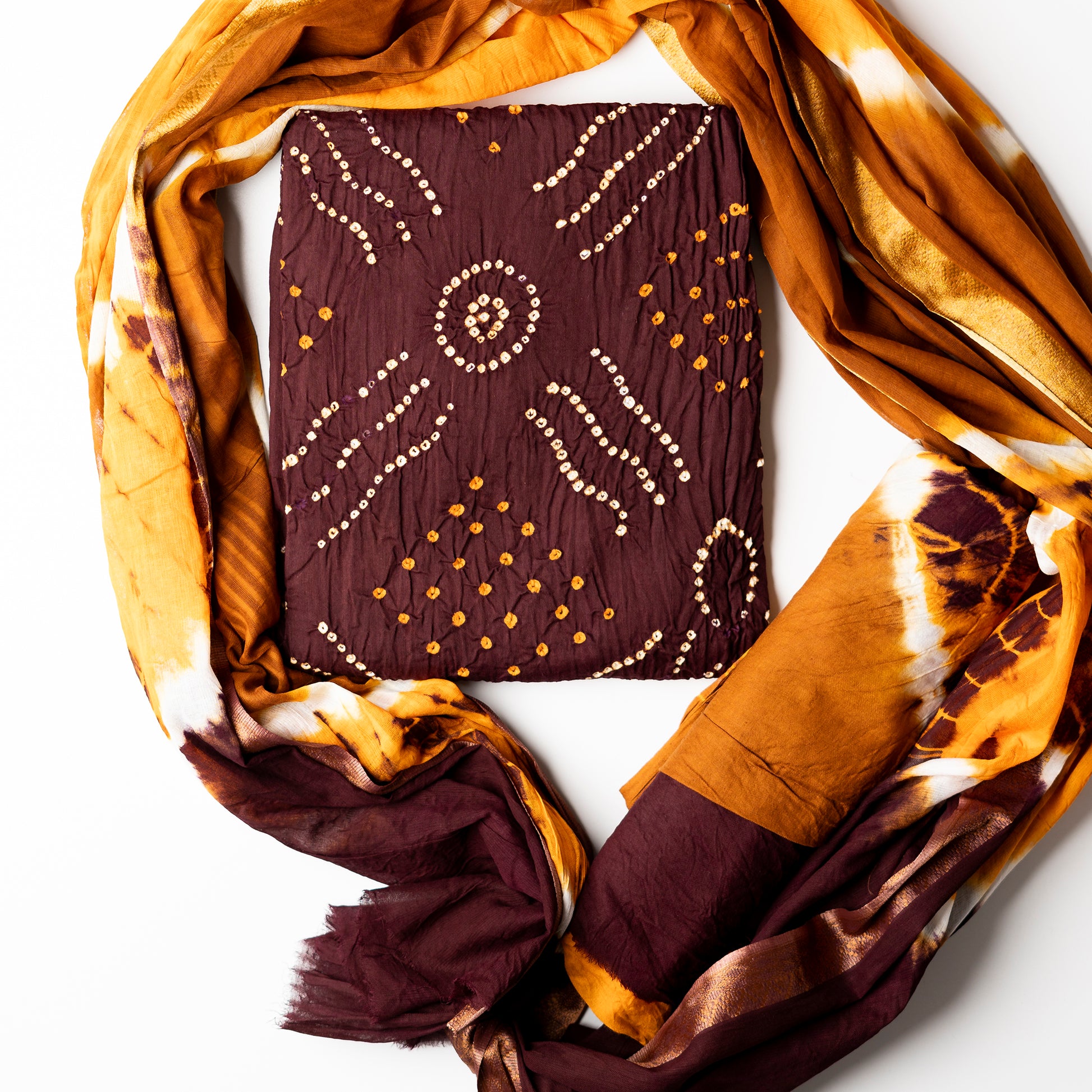 brown color cotton bandhani top with yellow and white color bandhej design. Cotton multi color shibori design dupatta and bottom