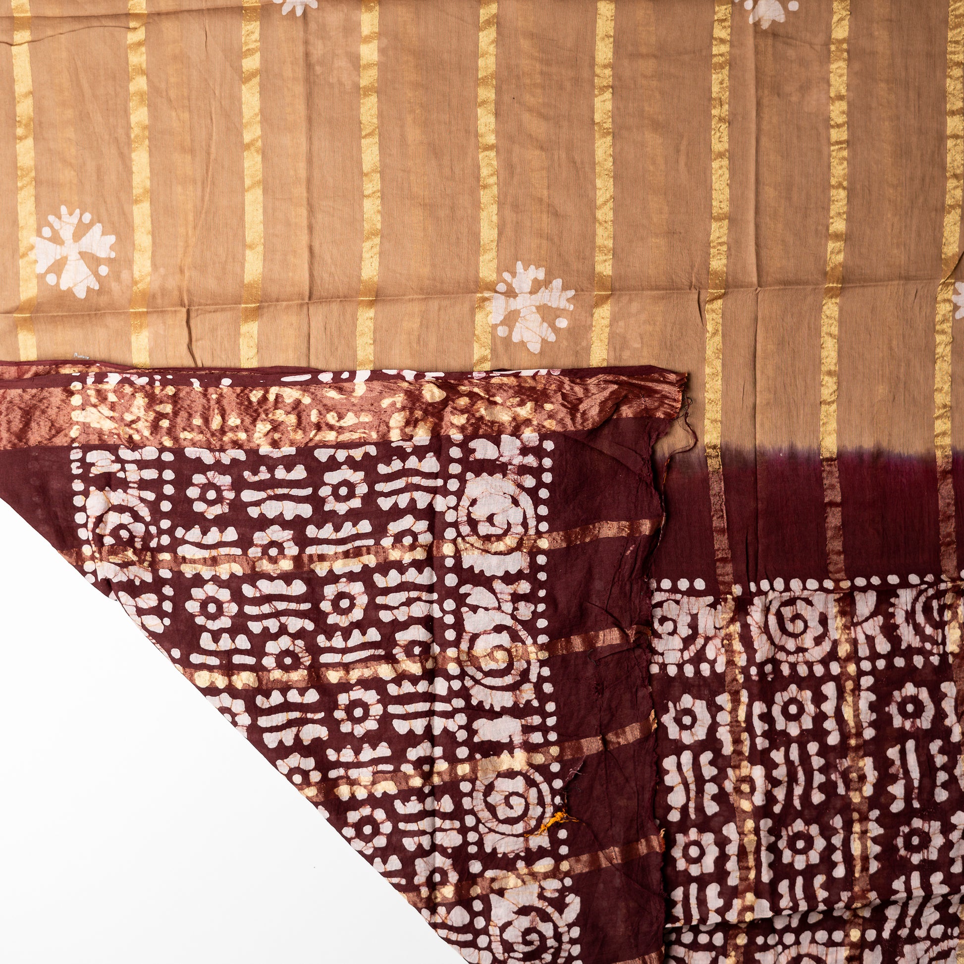 Cotton dupatta with golden color lines and wax batik prints.