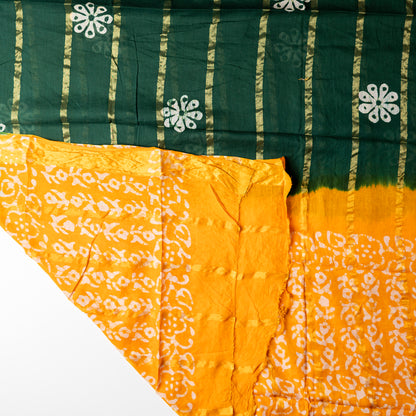 Cotton green and yellow color dupatta with golden color lines in between and wax batik prints