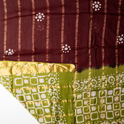 Cotton dupatta with golden color lines and wax batik prints.