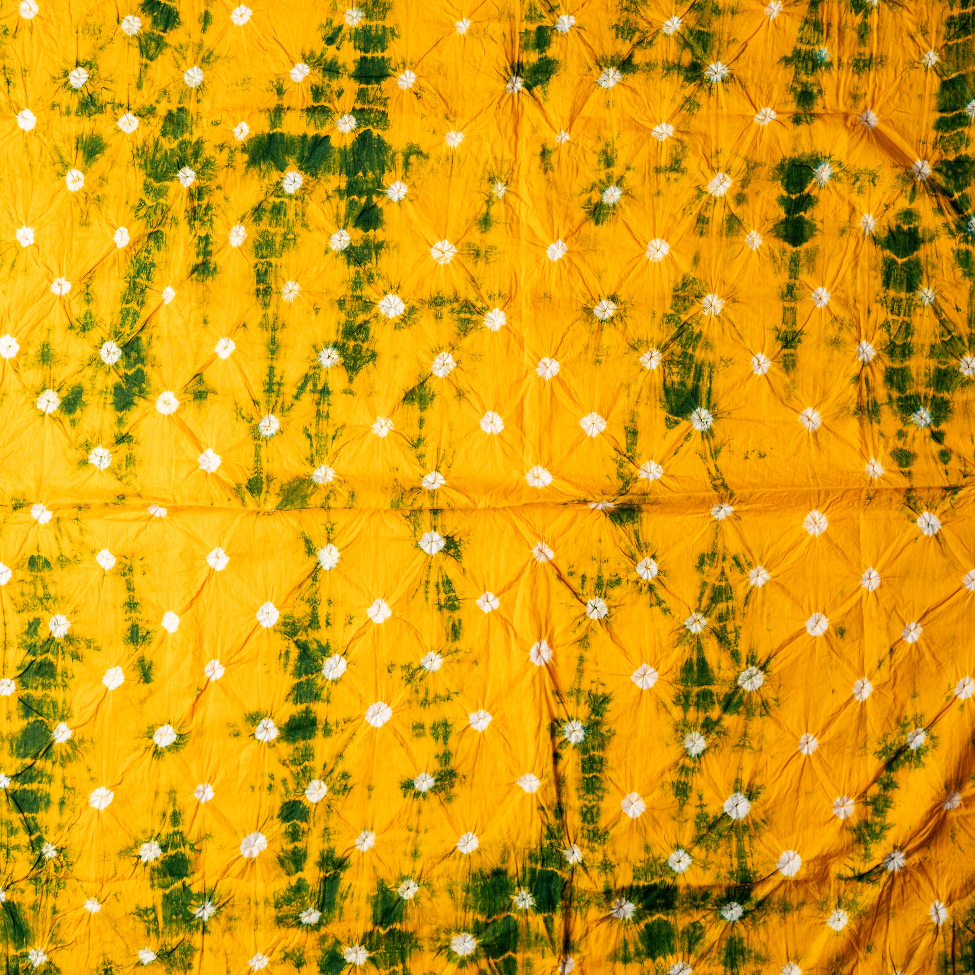 Yellow color bottom with green shibori design prints and white bandhej designs