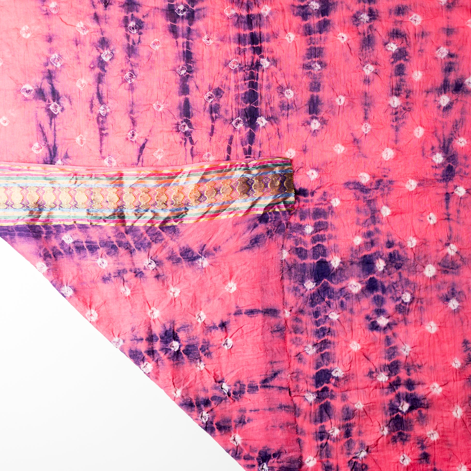 Pink color dupatta with shibori designs in blue color and golden borders. 