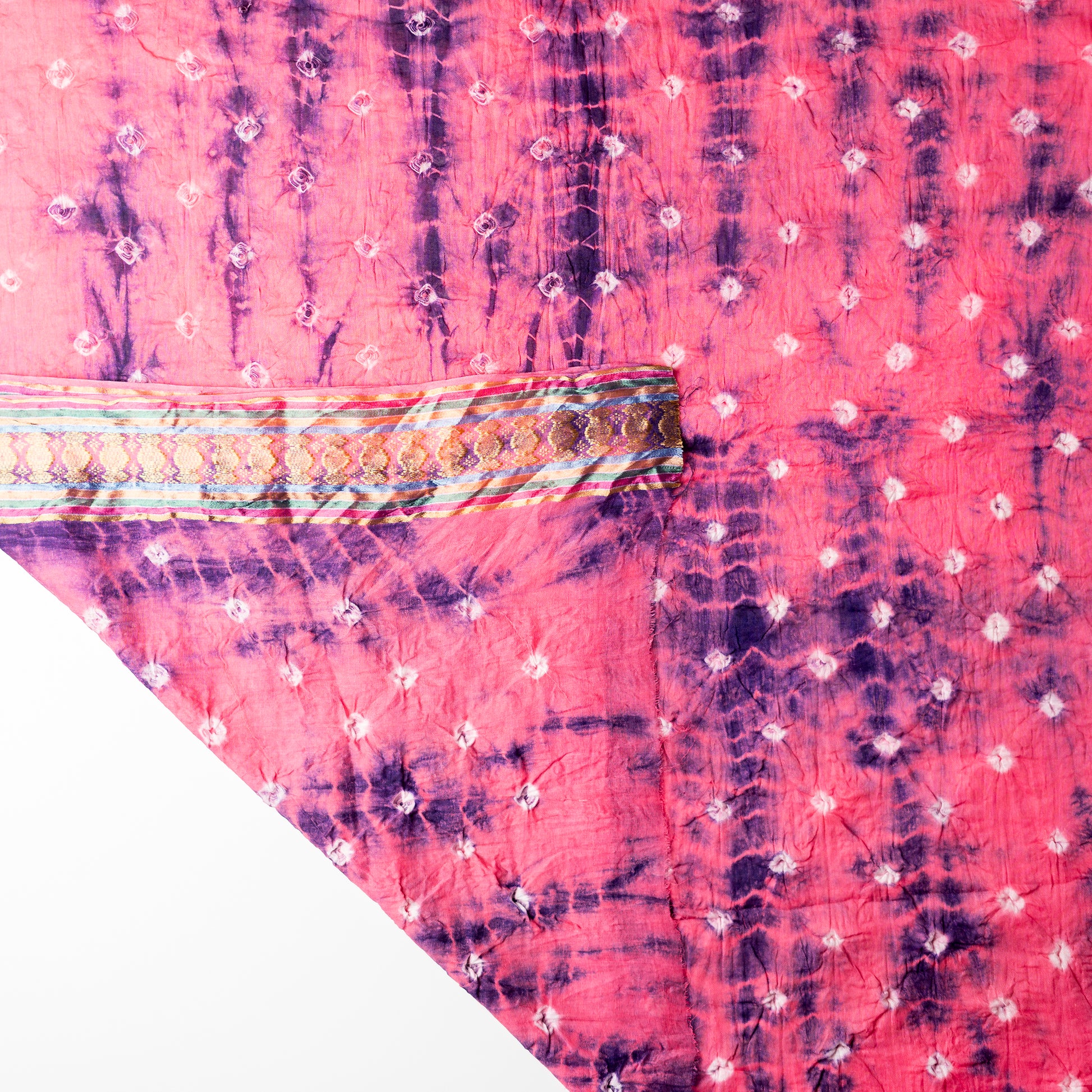 Pink color dupatta with shibori designs in blue color and golden borders.