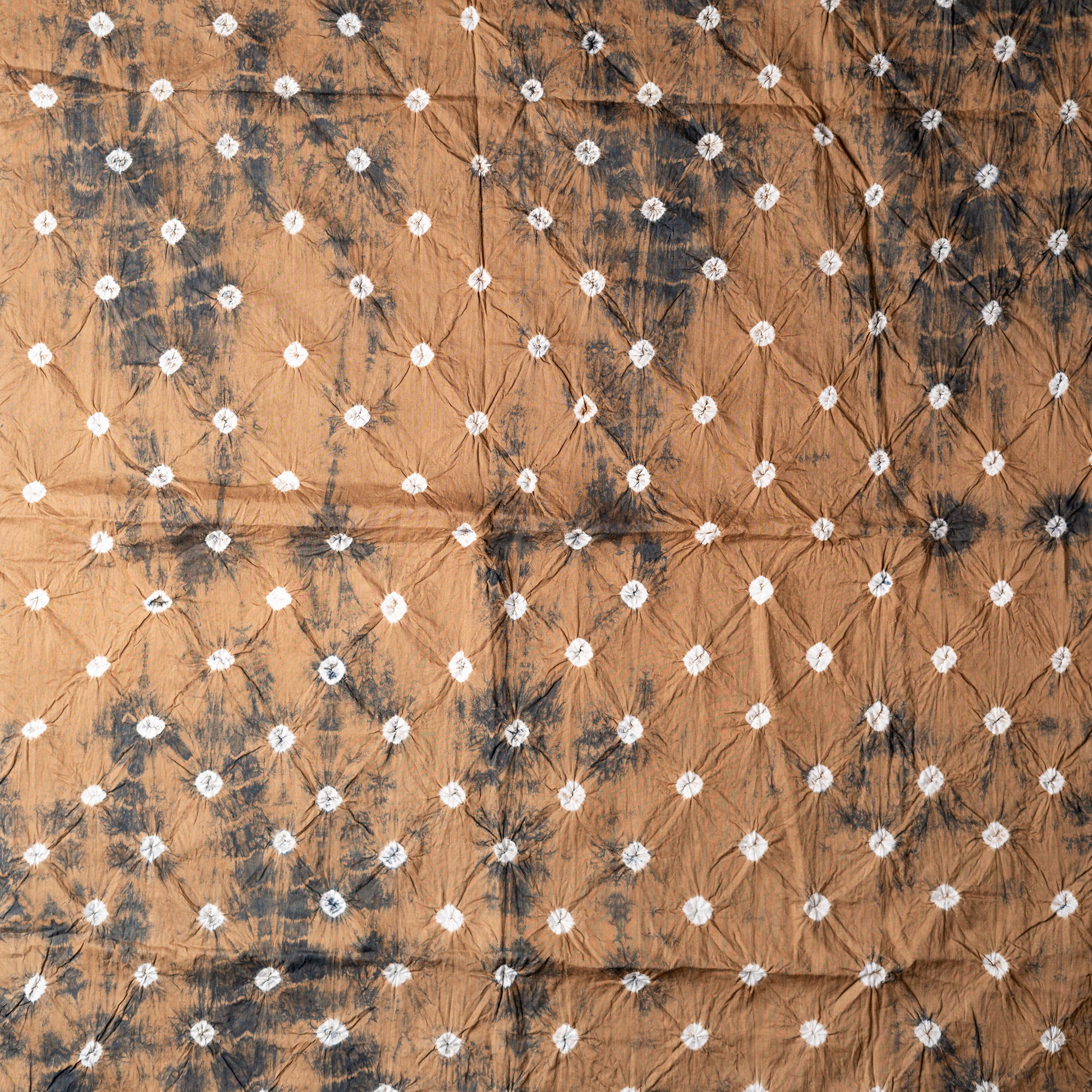 Brown color bottom with shibori designs in black color.