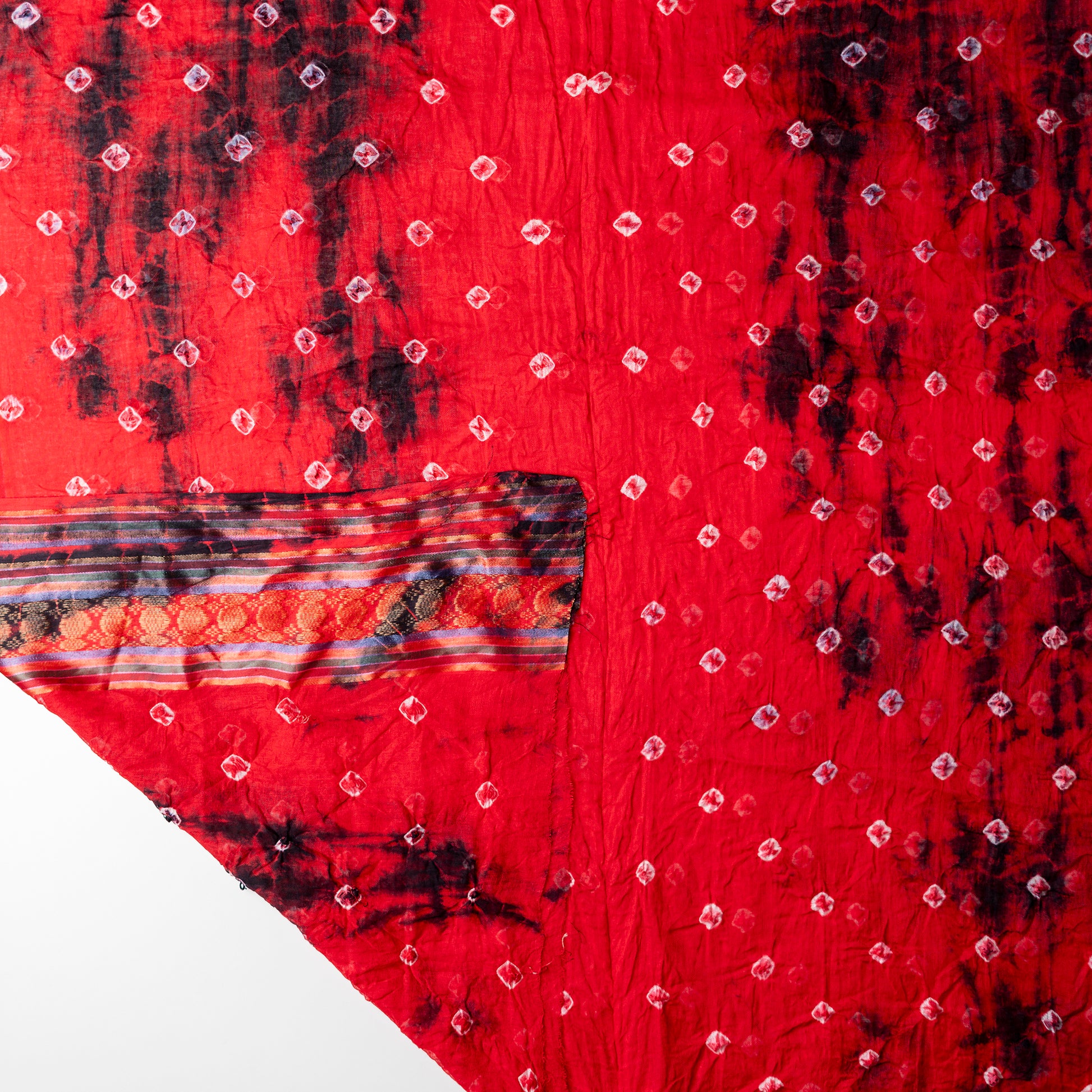 Red color dupatta with shibori designs in black color and golden borders.