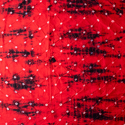 Red color bottom with shibori designs in black.
