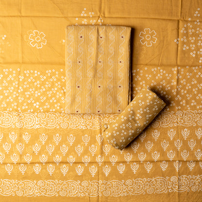 Cotton golden color top with katha work , cotton bottom with print design, mul cotton dupatta with matching print design.