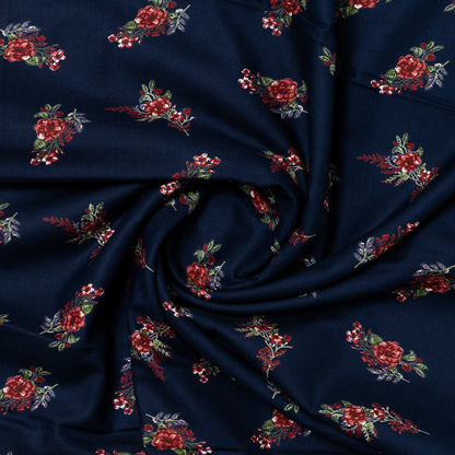 Navy blue color rayon printed fabric with floral designs in maroon and green color