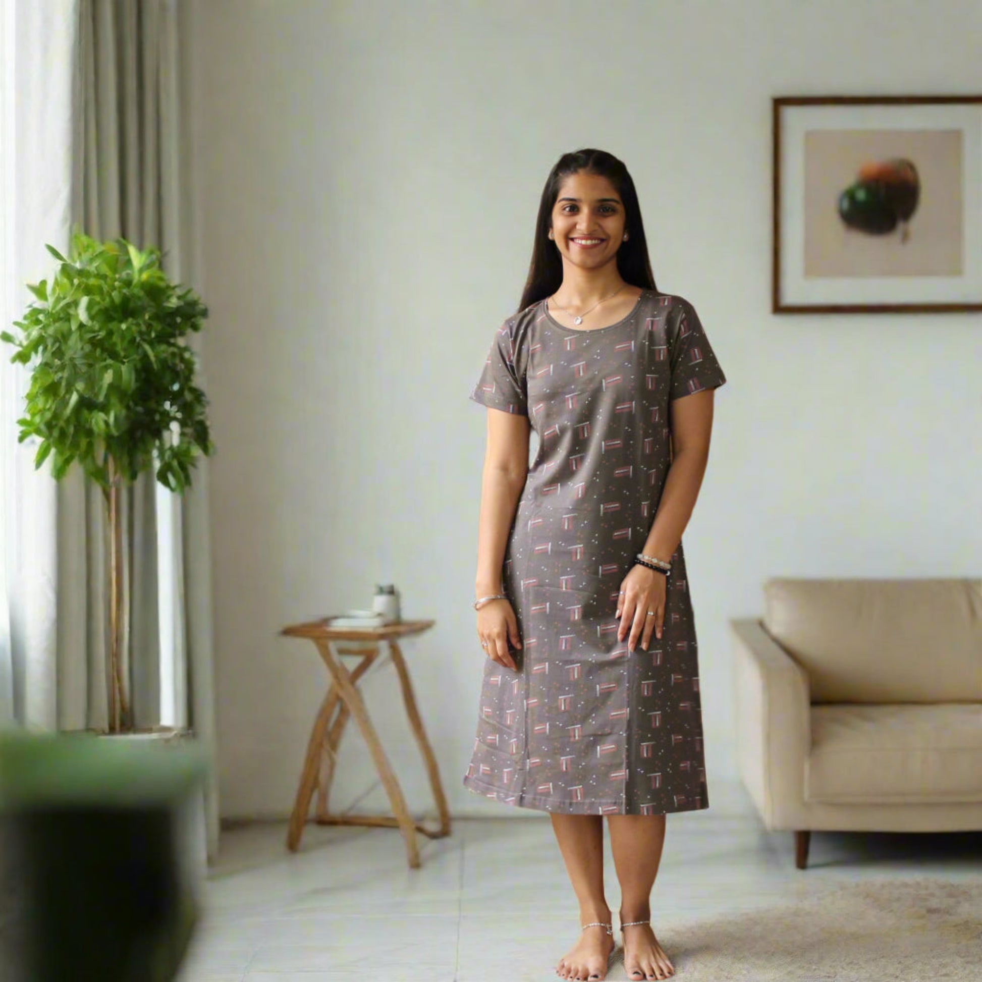 women wearing knee length printed cotton short nighty, prints all over, grey color