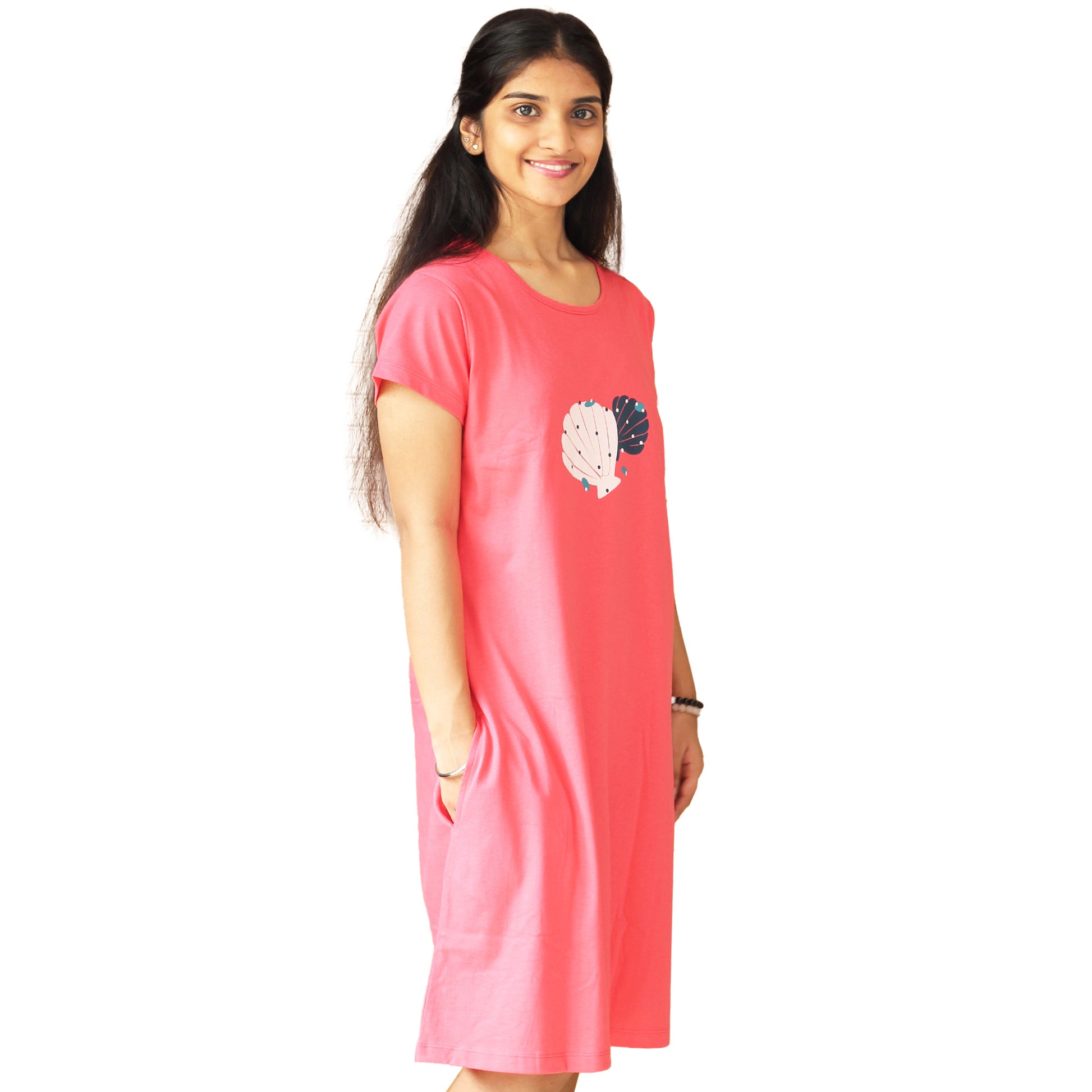 side view of coral color cotton knee length short nighty with floral print on the chest area