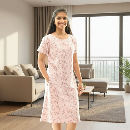 Women wearing light pink color cotton short nighty with hands in pocket