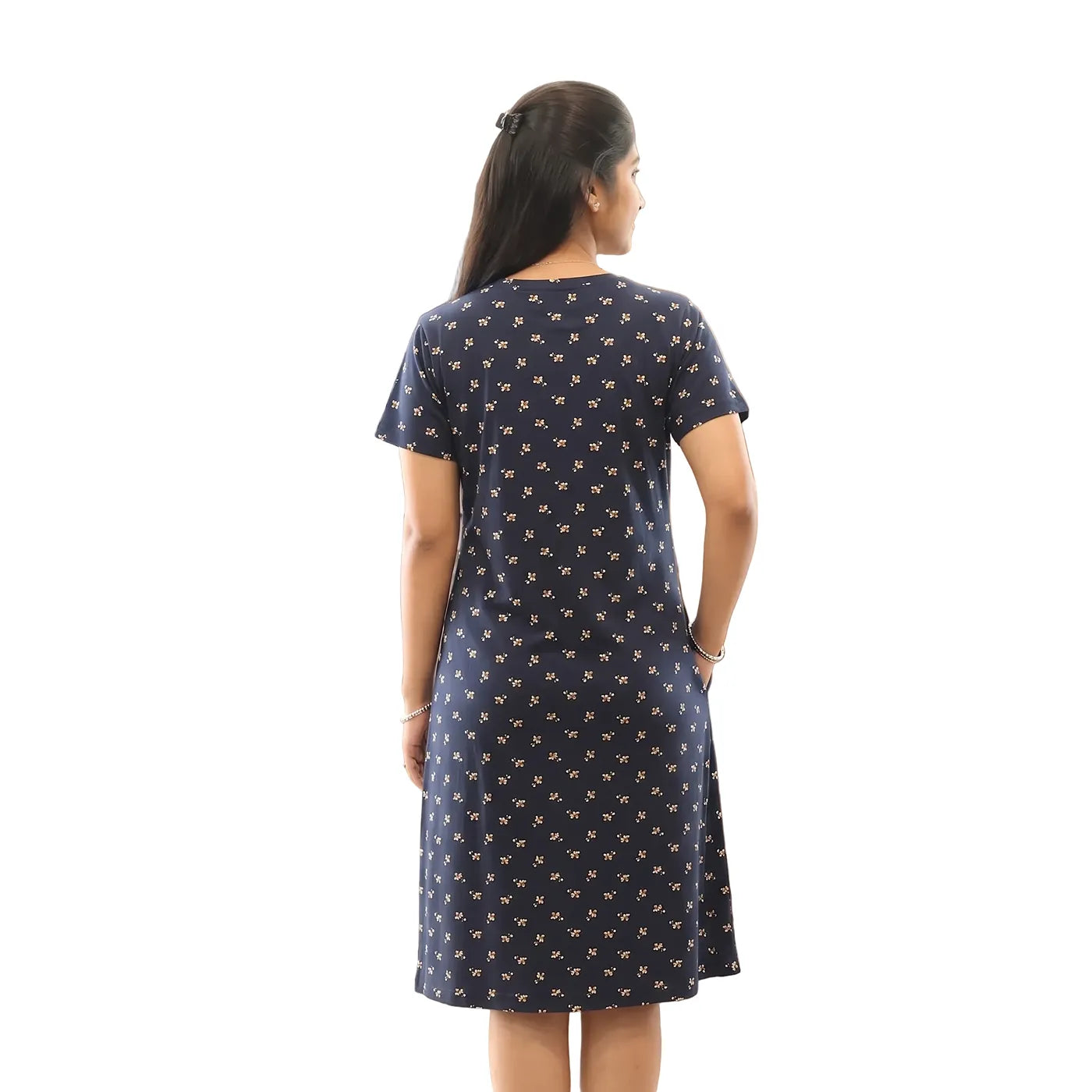 women standing backwards showing the backside view of the cotton navy floral printed short nighty