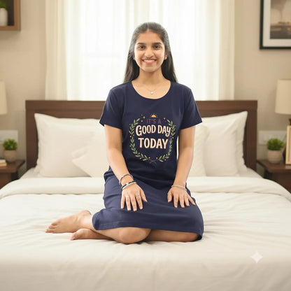 women sitting on a bed wearing hosiery cotton knee length short nighty in dark navy color 
