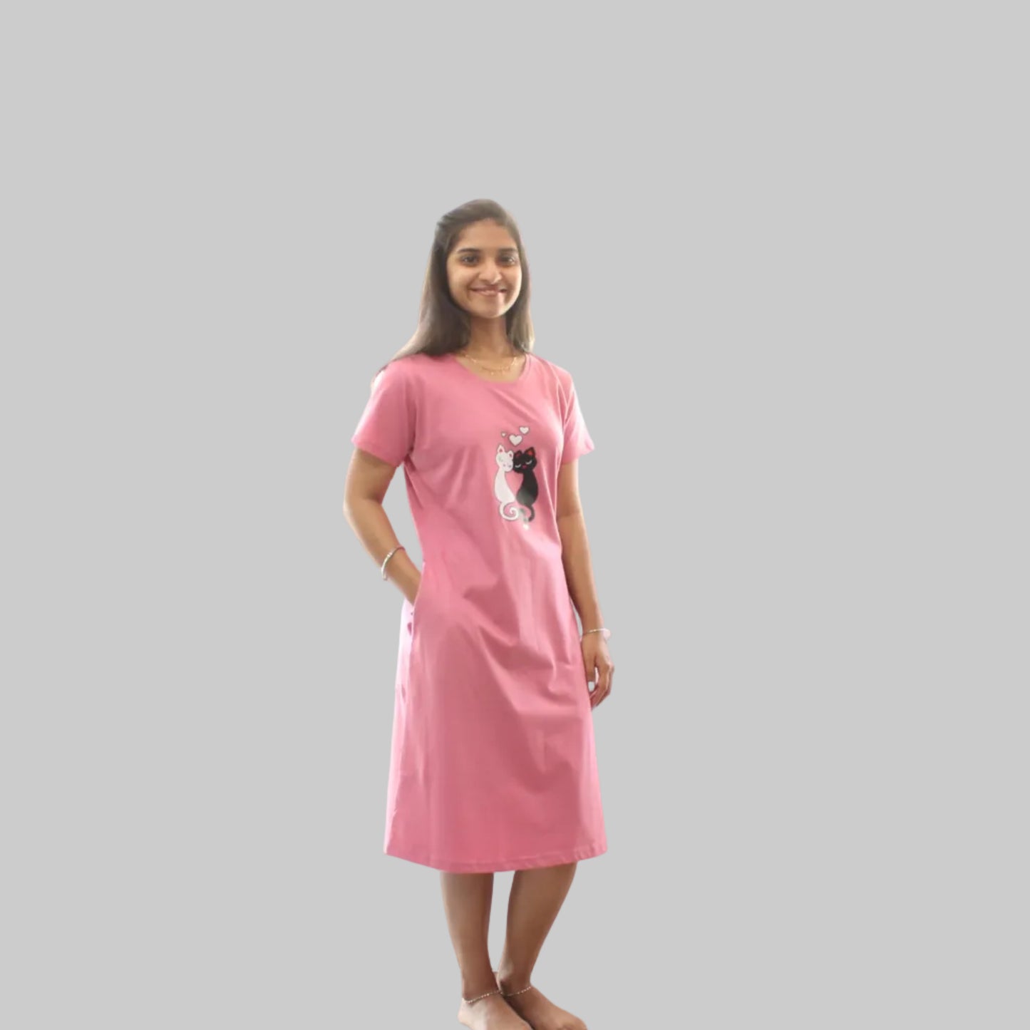 Woman wearing a pink nightgown with pocket
