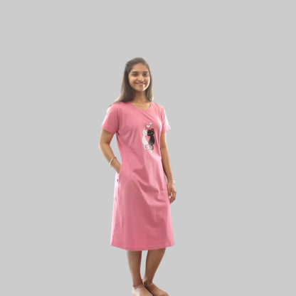 Woman wearing a pink nightgown with pocket
