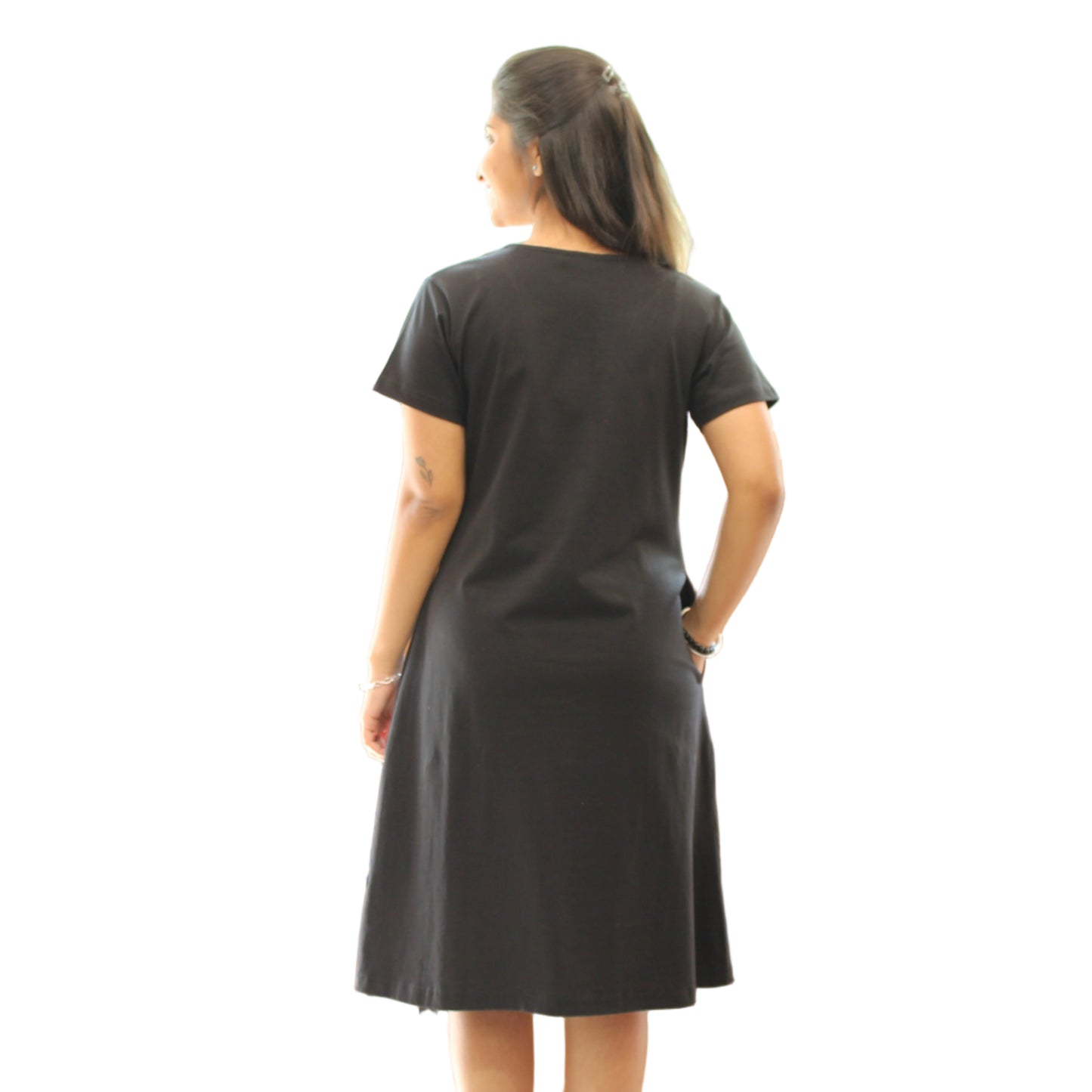 women wearing black color cotton short nighty , standing showing the backside view